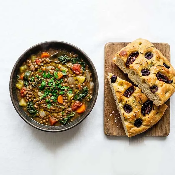 French lentil and vegetable stew with olive & sundried tomato focaccia